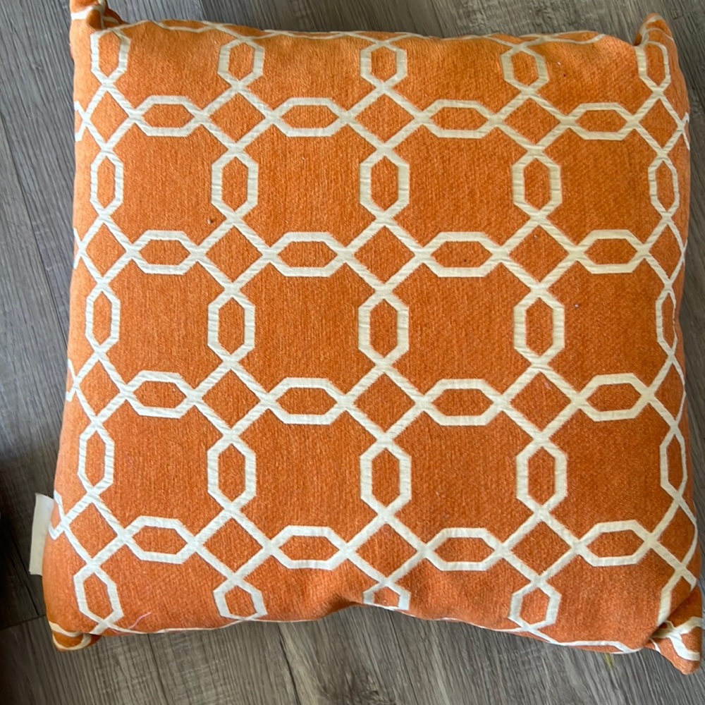 Two decorative pillows slightly used orange cream square